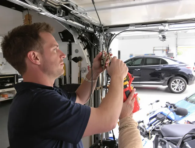 Hilton Head Island Garage Door Repair safety certified technician performing cable replacement in Hilton Head Island